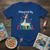 Powered By CEREAL text with a rocket launching through cereal and milk graphic on a navy t-shirt