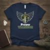 Prayer Warrior T-Shirt with shield, sword, and wings graphic. Text reads "Prayer WARRIOR"