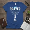 Prayer The Strongest Wireless Connection Christian T-Shirt design with white text and a graphic of a person kneeling at a