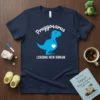 Navy blue t-shirt with "Preggosaurus Loading New Human" text and a blue dinosaur graphic with a heart on its belly