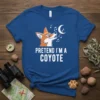 Pretend I'm A Coyote text with a cartoon fox howling at the moon and musical notes on a blue t-shirt