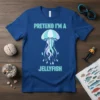Blue t-shirt with "Pretend I'm a Jellyfish" text and a cartoon jellyfish graphic in pastel colors