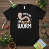 Black t-shirt with "Pretend I'm A Worm" text and a cute cartoon worm graphic in the center