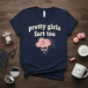 Navy blue t-shirt with "pretty girls fart too" in cream text, featuring a pink cloud graphic with a woman's profile