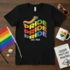 Black t-shirt with "PRIDE PRIDE PRIDE PRIDE EST. 1969" in colorful wavy text and a rainbow arc above