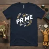 PRIME text design with a crown, laurel wreaths, and an arrow on a navy t-shirt, symbolizing achievement and top performance