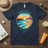 Primo Playa Sea Isle City 2024 t-shirt design featuring a circular graphic of a sunny beach scene with palm trees