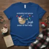 Sloth hanging on Christmas lights with text "probably just gonna Jingle some of the way" on a blue t-shirt