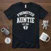 Promoted to Auntie Est. 2026 t-shirt with distressed font and baby footprints graphic