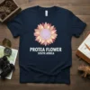 Navy t-shirt with a colorful protea flower graphic and "Protea Flower South Africa" text