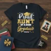 Proud Aunt of a 2026 Graduate t-shirt with gold glitter text and graduation cap graphic