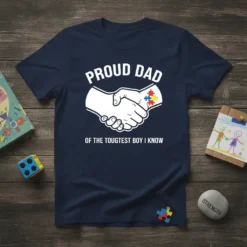 Proud Dad Of The Toughest Boy I Know T-Shirt with handshake and autism puzzle pieces graphic