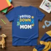 Proud Down Syndrome Mom t-shirt with blue awareness ribbon, socks, and sun graphic