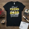 Proud Friend of a Class of 2022 College Graduate text on a black t-shirt with graduation cap graphic