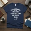 Navy t-shirt with white text reading "Proud Member of the Just Resting My Eyes Club" and a sleeping eye graphic