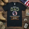 Proud National Guard Dad t-shirt design with text and silhouette of a soldier saluting, featuring camouflage DAD and combat boots