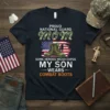 Proud National Guard Mom t-shirt with combat boots graphic and American flag, featuring the quote "Some Heroes Wear Capes My