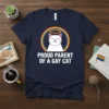 Proud Parent of a Gay Cat T-Shirt with white text and a smiling cat inside a rainbow halo