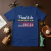 Proud to be Venezuelan American text with Venezuelan and US flag elements on a blue t-shirt