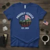 Proudly Served Est. 2024 t-shirt design featuring a circle with the American flag, silhouetted service members, and mountains