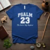 Psalm 23 The Lord is My Shepherd Christian T-Shirt with bold white text and script font on a blue tee