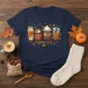 Pumpkin Spice Everything Fall Vibes T-Shirt featuring four fall coffee drinks and autumn leaves design