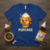 Pupcake t-shirt design featuring a cute cartoon dog inside a cupcake with the word PUPCAKE below
