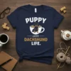 Puppy Love Dachshund Life text with a dachshund in a coffee cup graphic on a navy t-shirt