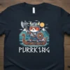 PURRK1NG Viking Cat T-Shirt featuring a cartoon cat dressed as a Viking on a longship, holding an axe and shield