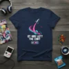 Navy t-shirt with "QT Has Left The Chat" text, a rocket launching through a pink and teal swirl, and an