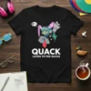 Black t-shirt with white text "QUACK LISTEN TO THE DUCKS" and a cartoon duck graphic wearing a suit and bunny