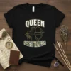 Queen Sagittarius text with a silhouette of a woman archer wearing a crown, outlined in gold on a black t-shirt