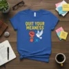 Blue t-shirt with "Quit Your Meanness" text, a broken chain fist, and a white dove graphic