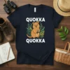 Navy t-shirt with "QUOKKA QUOKKA" text above and below a cute illustration of a quokka holding a leaf
