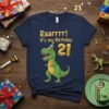 Raaarrr! It's my Birthday 21 T-Shirt with a cartoon T-Rex wearing a party hat and holding balloons