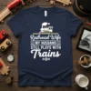 Railroad Wife MY HUSBAND STILL PLAYS WITH Trains t-shirt design with a steam train graphic and white text