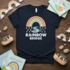 Rainbow Bridge T-Shirt design featuring pastel rainbow and water graphic with text "RAINBOW BRIDGE" in white font