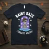 Rainy Daze Forever Moody skeleton t-shirt design featuring a skeleton wearing a hat in the rain with sheep