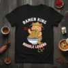 Ramen King Noodle Legend text with a cute cat eating ramen graphic on a black t-shirt