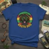 Rasta Dog T-Shirt featuring a black dog with dreadlocks and sunglasses against a circular background of red, yellow, green, and