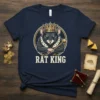 Rat King T-Shirt design with a crowned rat holding a scepter, text "RAT KING" below, on a navy blue shirt