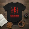 Black t-shirt with red "RAW POWER UNLEASHED VOLTAGE" text and lightning bolt graphics