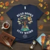 Read Books Stay Weird t-shirt design featuring a tree with books, an owl, a castle, and the phrase BE KIND