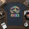 Reading Rocks t-shirt with colorful wings, open book, and lightning bolt graphic