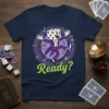 Ready? text with a cartoon dancing die character in a tuxedo on a navy blue t-shirt, surrounded by musical notes