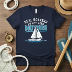 Real Boaters Do Not Need Motors quote on a navy t-shirt with a white sailboat graphic