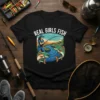 Real Girls Fish t-shirt design featuring a woman fishing in a river with two salmon jumping