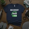 Recovery Mode On t-shirt with green switch graphic and text "RECOVERY MODE ON" in white and green