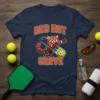 Red panda playing pickleball with "Red Hot Serve" text on a navy blue t-shirt