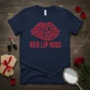 Red Lip Kiss text design on a navy blue t-shirt with a red swirling lip graphic above it